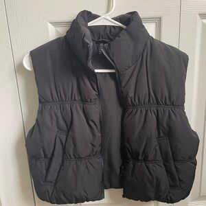 Black cropped H&M puffer vest.